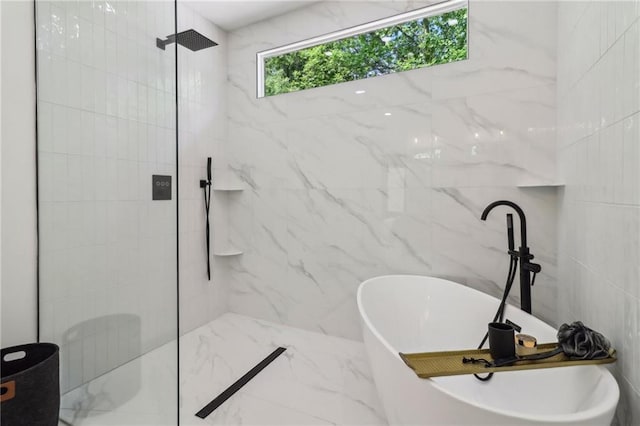 1129 Victory Dr SW, Atlanta, GA 30310 - full bathroom featuring a freestanding tub, a marble finish shower, tile walls, and marble finish flooring