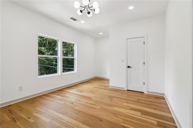1129 Victory Dr SW, Atlanta, GA 30310 - spare room with a chandelier, light wood-style floors, recessed lighting, and baseboards