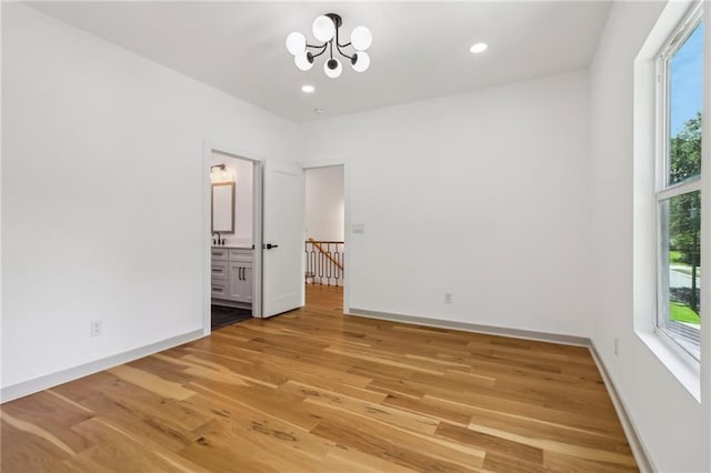 1129 Victory Dr SW, Atlanta, GA 30310 - spare room with plenty of natural light, a chandelier, light wood finished floors, baseboards, and recessed lighting