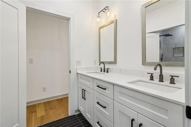 1129 Victory Dr SW, Atlanta, GA 30310 - full bath featuring double vanity, wood finished floors, and a shower