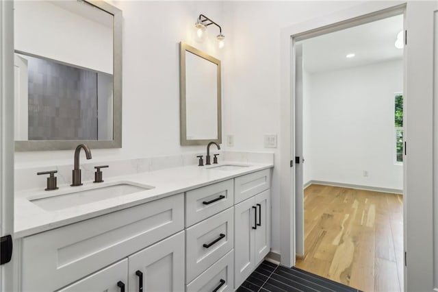 1129 Victory Dr SW, Atlanta, GA 30310 - full bath featuring double vanity and wood finished floors