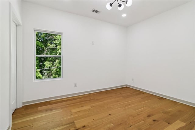 1129 Victory Dr SW, Atlanta, GA 30310 - spare room with a chandelier, light wood-style floors, baseboards, and recessed lighting