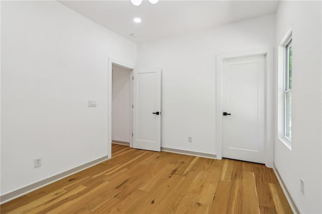 1129 Victory Dr SW, Atlanta, GA 30310 - unfurnished bedroom with light wood finished floors, baseboards, and recessed lighting