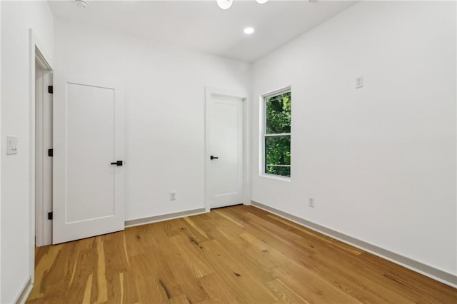 1129 Victory Dr SW, Atlanta, GA 30310 - unfurnished bedroom with light wood-style floors, baseboards, and recessed lighting