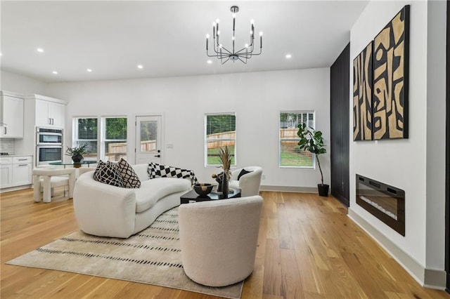1129 Victory Dr SW, Atlanta, GA 30310 - living area with recessed lighting, light wood-style flooring, a chandelier, and baseboards