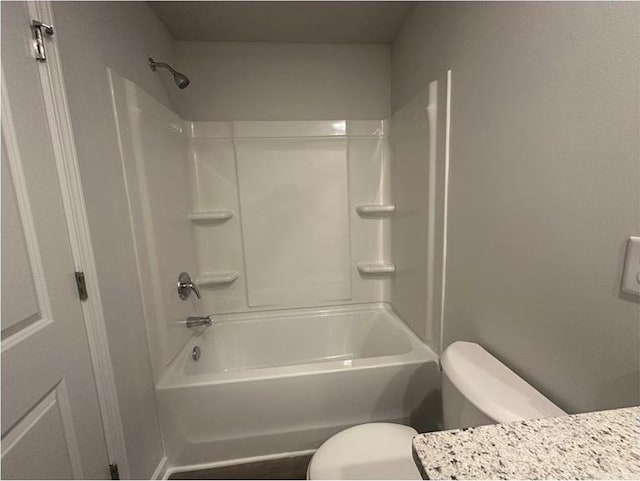 75 Emerald Ln, Covington, GA 30014 - bathroom featuring toilet, shower / bathtub combination, and vanity