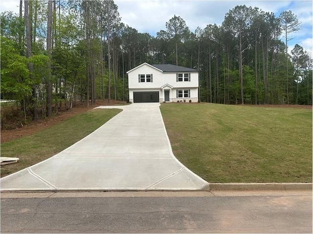 75 Emerald Ln, Covington, GA 30014 - view of front facade featuring a garage, a front yard, concrete driveway, and a wooded view