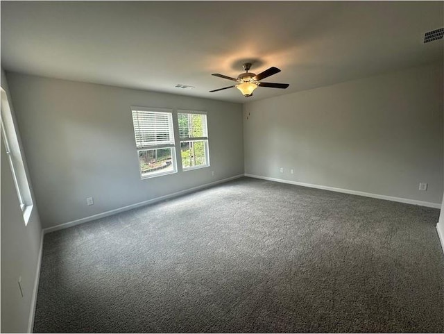 75 Emerald Ln, Covington, GA 30014 - spare room with a ceiling fan, baseboards, and carpet flooring