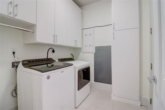 laundry room with cabinets and washer and clothes dryer