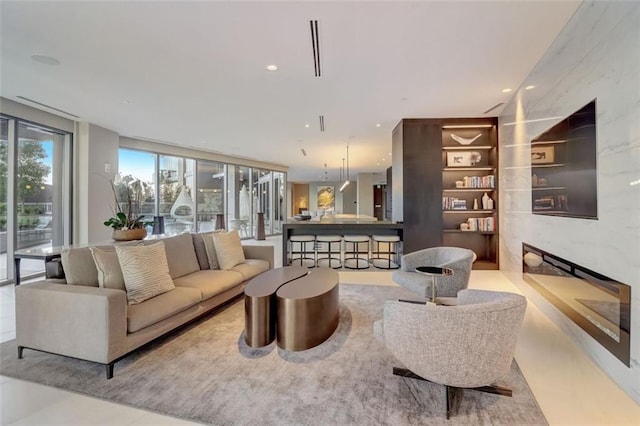 living room featuring floor to ceiling windows