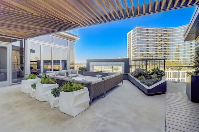 balcony featuring outdoor lounge area and a patio area