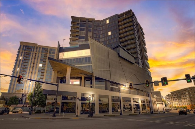 view of outdoor building at dusk