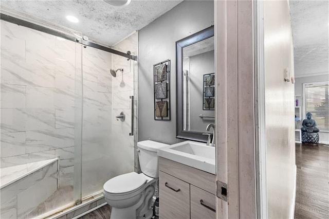 2446 Martin Luther King Jr Blvd, Gainesville, GA 30501 - full bath with a textured ceiling, vanity, a shower stall, and wood finished floors