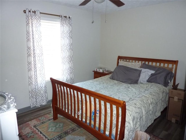 bedroom featuring wood finished floors and a ceiling fan