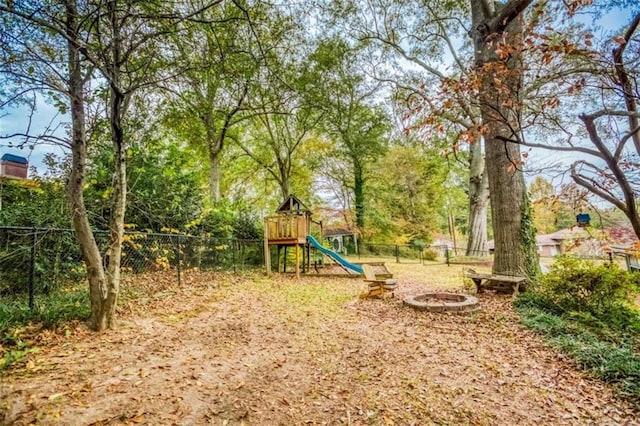 view of playground featuring fence