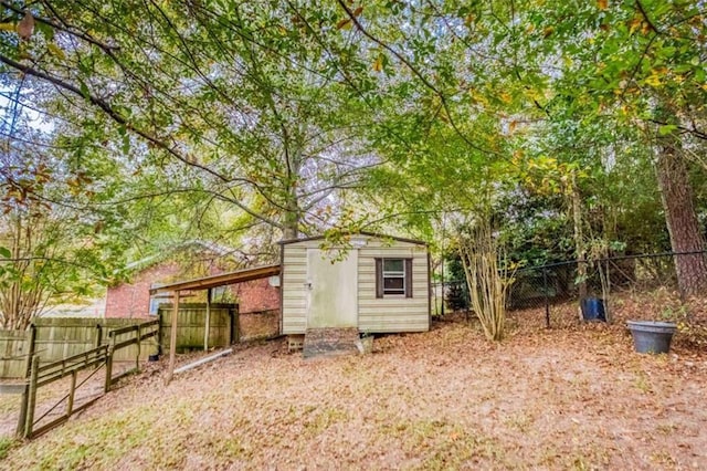 view of shed featuring a fenced backyard