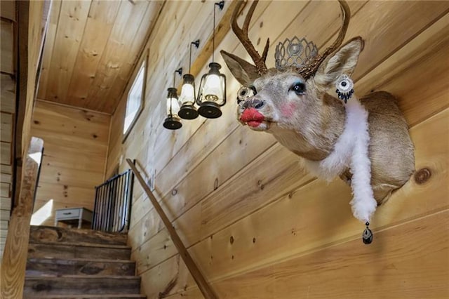 room details featuring wood walls and wooden ceiling