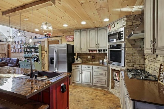 kitchen featuring light hardwood / wood-style floors, stainless steel appliances, pendant lighting, sink, and wooden ceiling