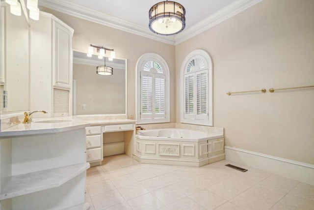 bathroom featuring ornamental molding, tile patterned floors, a garden tub, and vanity