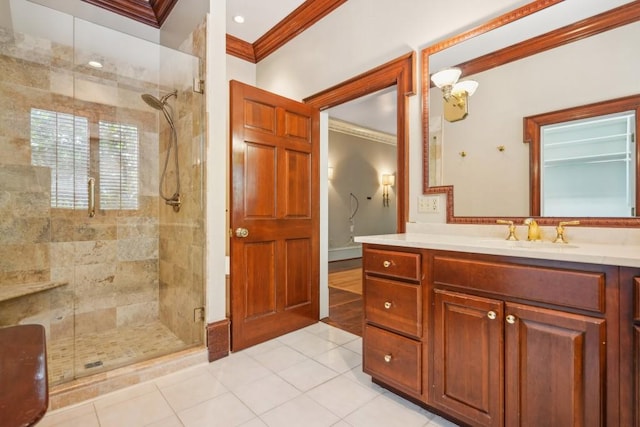 full bath with crown molding, a stall shower, tile patterned flooring, and vanity