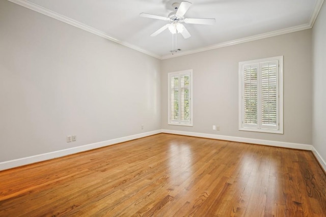unfurnished room featuring light wood finished floors, baseboards, ornamental molding, and ceiling fan
