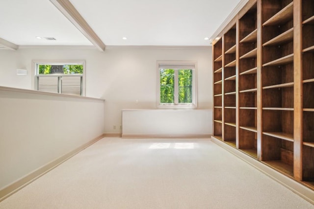 carpeted empty room featuring healthy amount of natural light, ornamental molding, baseboards, and recessed lighting