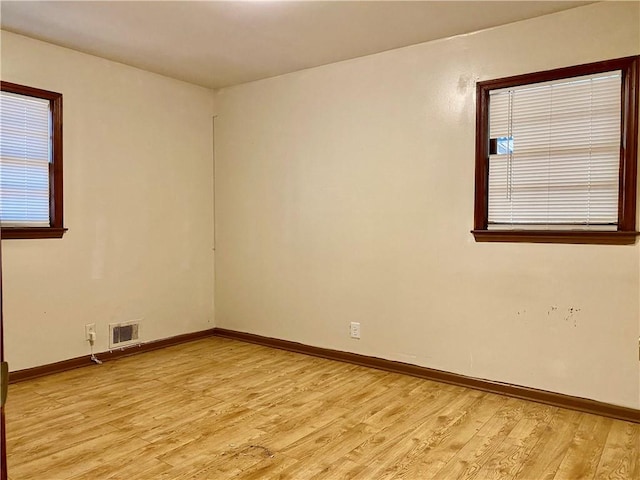 unfurnished room featuring light hardwood / wood-style flooring