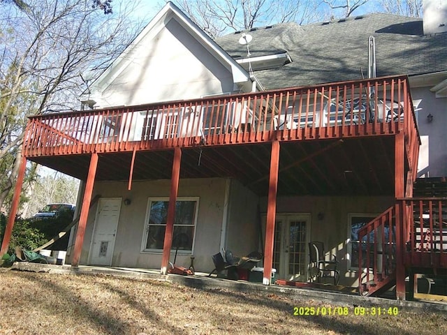 back of property with a deck