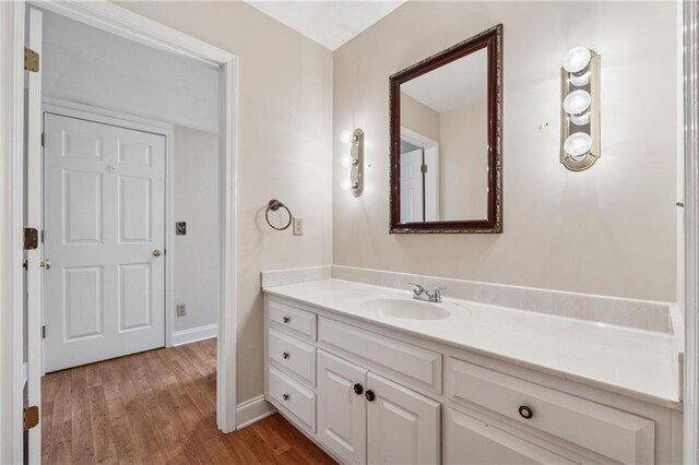 37 Long Branch Way, Dahlonega, GA 30533 - bathroom with vanity, baseboards, and wood finished floors