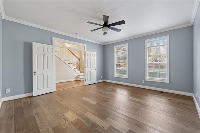 37 Long Branch Way, Dahlonega, GA 30533 - spare room featuring baseboards, a ceiling fan, crown molding, stairs, and hardwood / wood-style floors