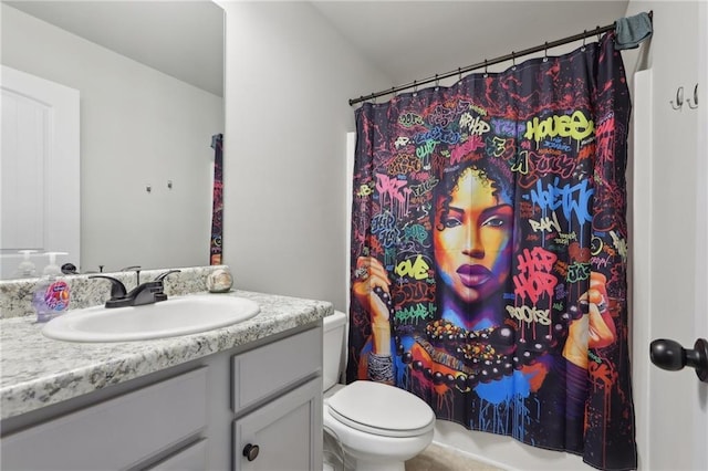 bathroom with toilet and vanity