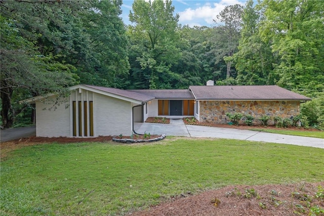 4717 Westhampton Dr, Tucker, GA 30084 - mid-century home with driveway, a chimney, a front lawn, a wooded view, and a garage