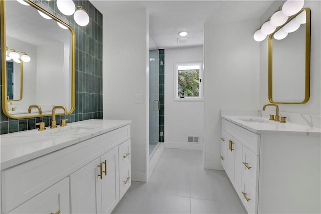 4717 Westhampton Dr, Tucker, GA 30084 - full bath featuring two vanities, a shower stall, tile walls, tile patterned flooring, and baseboards