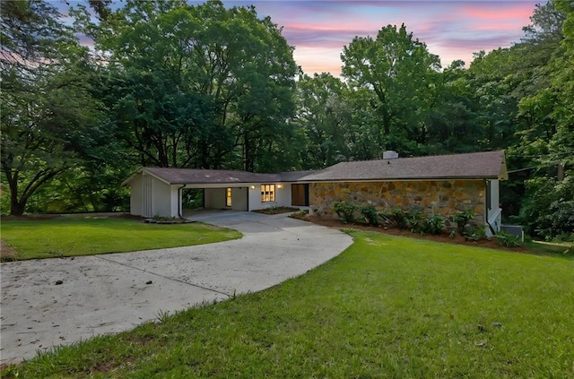 4717 Westhampton Dr, Tucker, GA 30084 - view of front of home featuring concrete driveway, stone siding, a lawn, and a carport