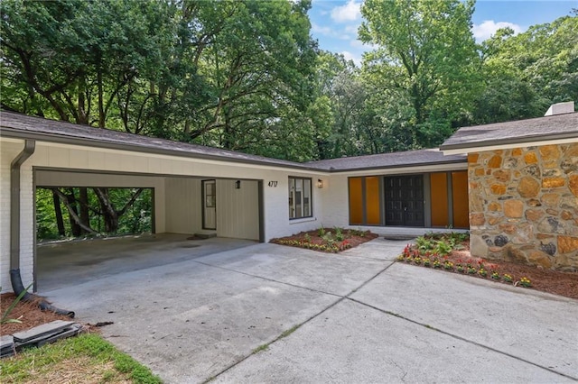 4717 Westhampton Dr, Tucker, GA 30084 - view of front of house with a carport, concrete driveway, and brick siding