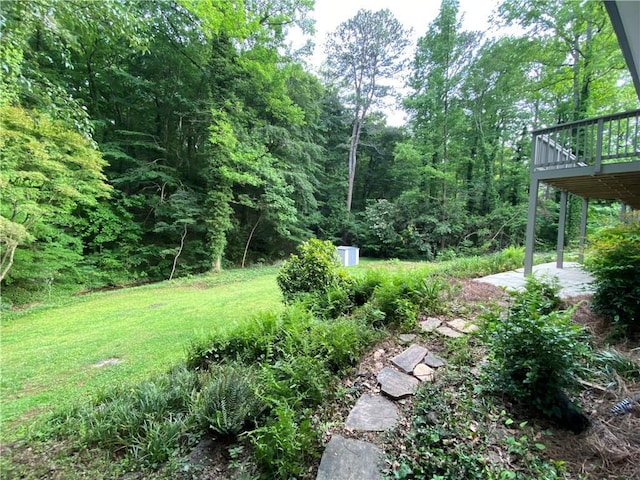4717 Westhampton Dr, Tucker, GA 30084 - view of green lawn with a wooden deck and a patio