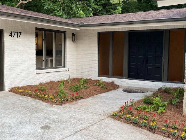 4717 Westhampton Dr, Tucker, GA 30084 - doorway to property with brick siding and roof with shingles