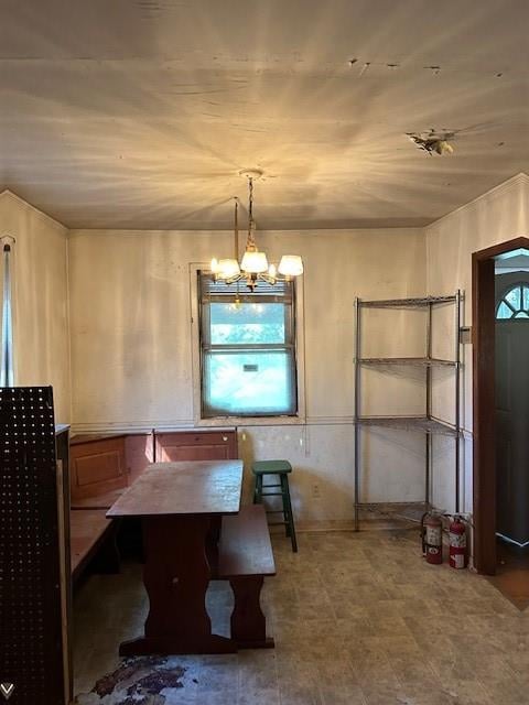 dining space featuring a notable chandelier