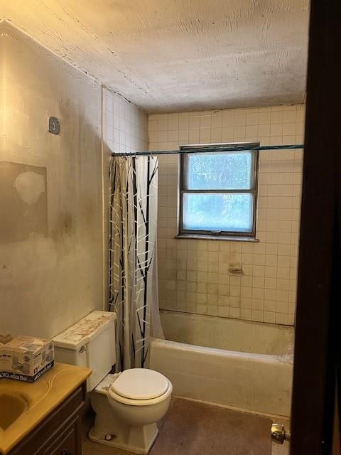 full bathroom featuring vanity, toilet, and shower / bathtub combination with curtain