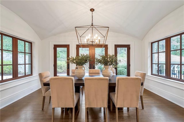 dining area with lofted ceiling, dark wood-style flooring, and baseboards