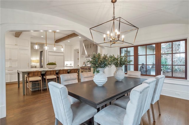 dining space with vaulted ceiling, an inviting chandelier, dark wood finished floors, and recessed lighting