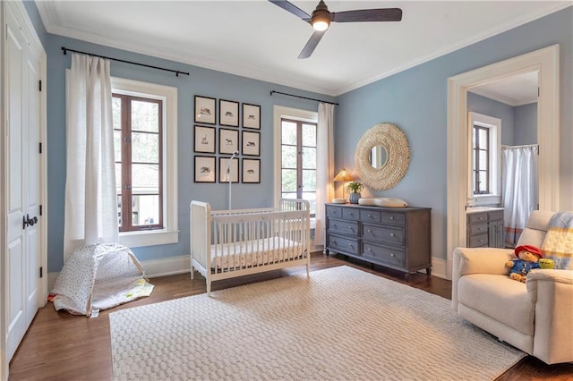 bedroom with french doors, crown molding, a ceiling fan, wood finished floors, and baseboards