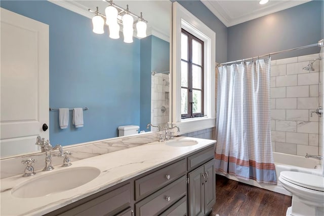 full bath featuring a sink, toilet, and crown molding