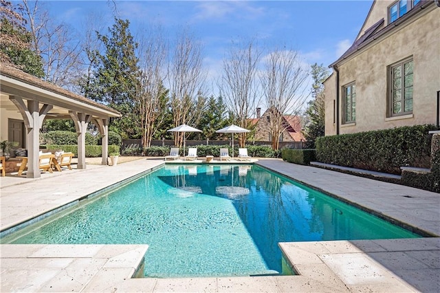 view of pool featuring a patio, fence, and a fenced in pool