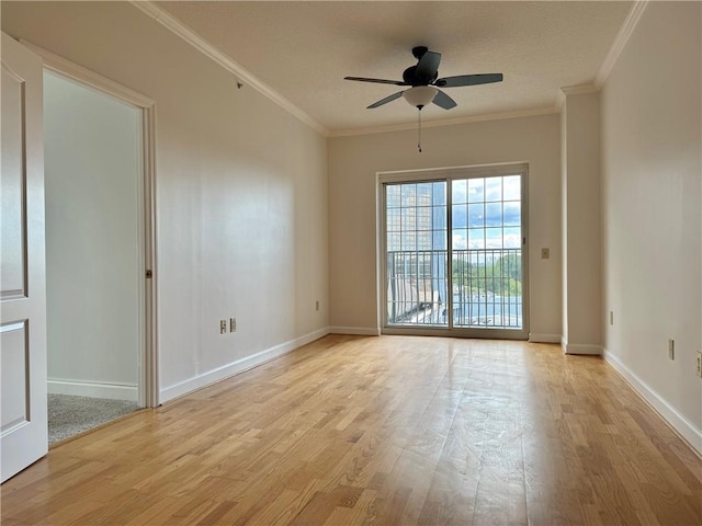 spare room with ceiling fan, light wood-type flooring, and crown molding