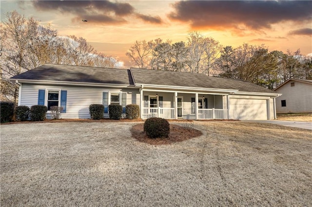 single story home with a garage and a porch