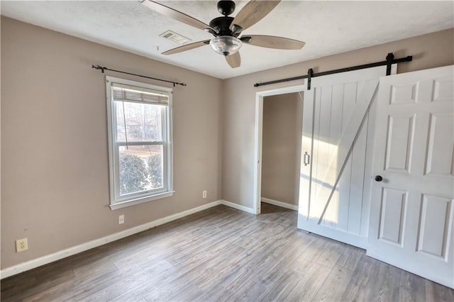 unfurnished bedroom featuring ceiling fan and light wood-type flooring