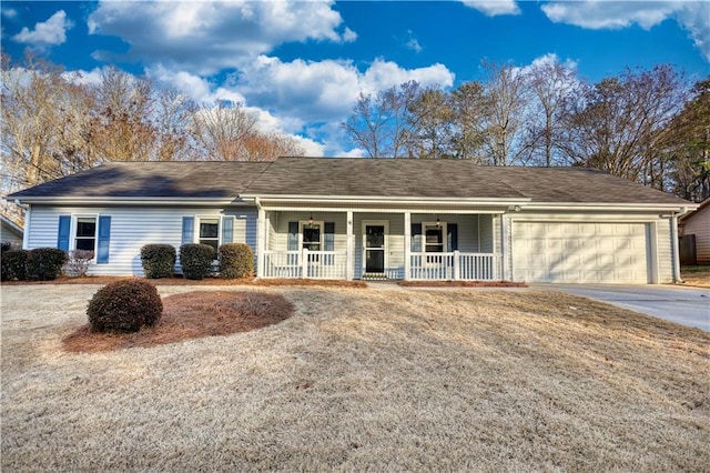 ranch-style home with a porch, a garage, and a front lawn