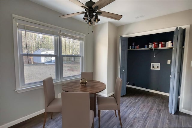 dining room featuring ceiling fan and dark hardwood / wood-style floors