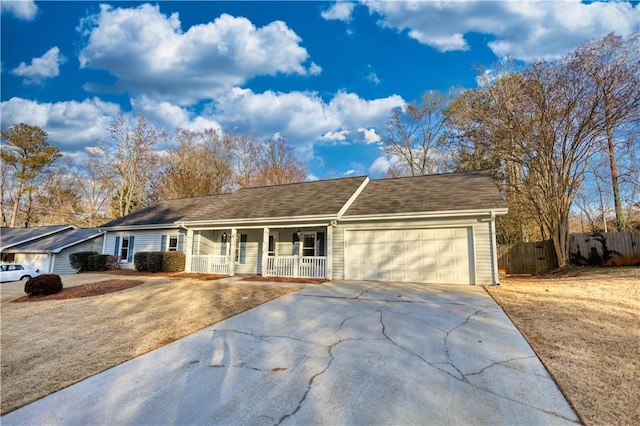 ranch-style home with a garage and covered porch